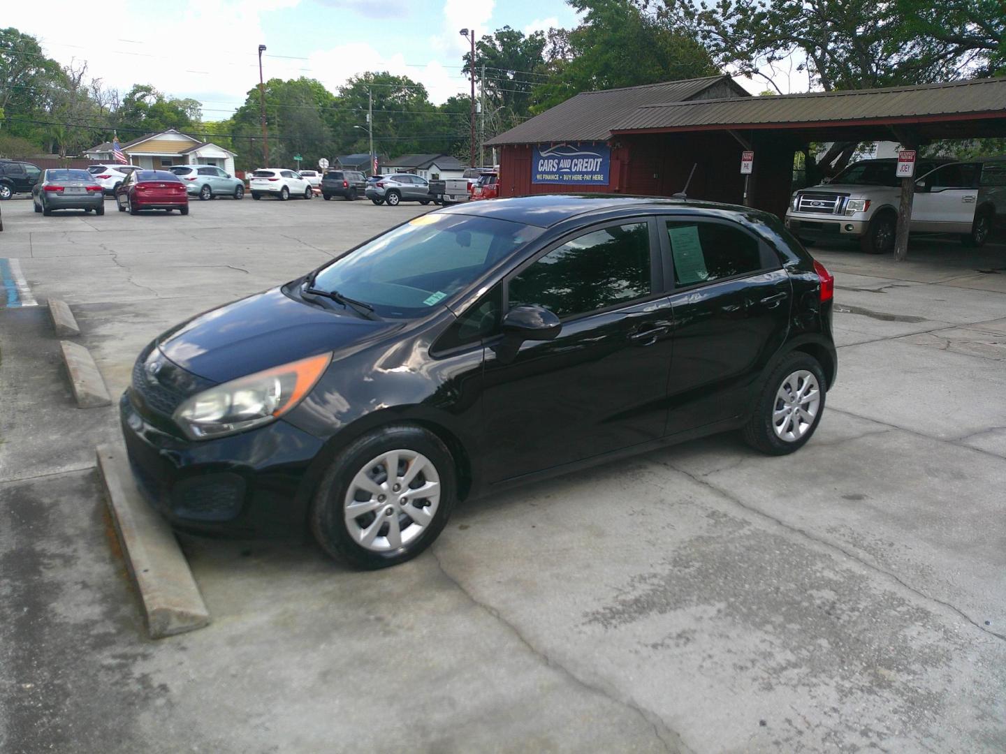 2013 BLACK KIA RIO LX (KNADM5A35D6) , located at 1200 Cassat Avenue, Jacksonville, FL, 32205, (904) 695-1885, 30.302404, -81.731033 - Photo#1