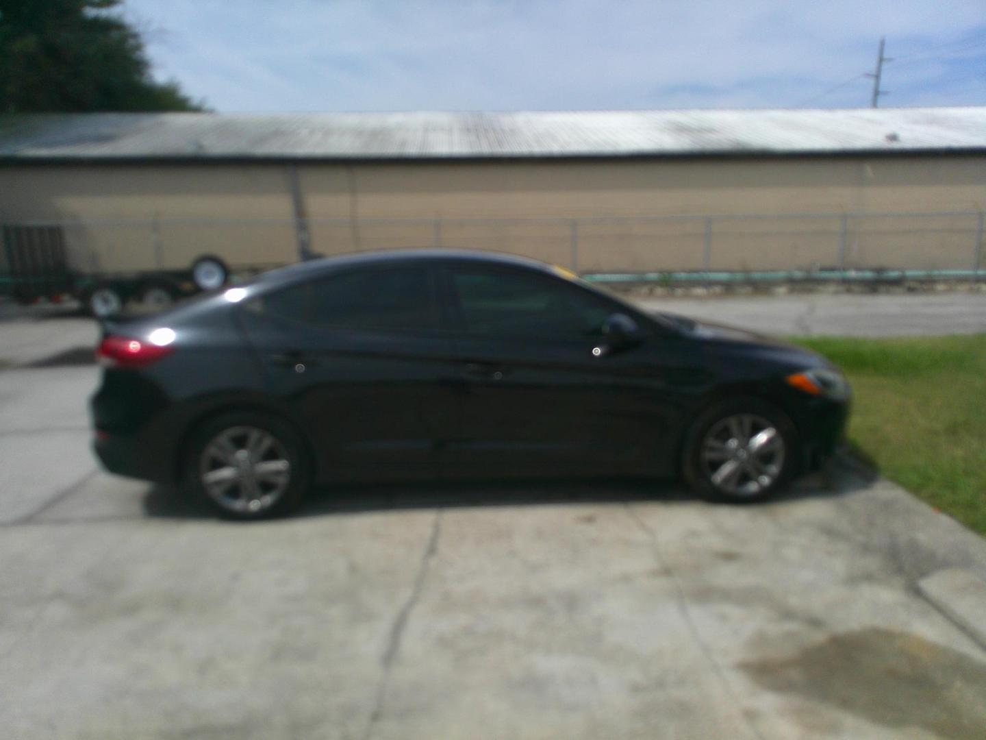 2017 BLACK HYUNDAI ELANTRA LIMITED; SE (5NPD84LF8HH) , located at 1200 Cassat Avenue, Jacksonville, FL, 32205, (904) 695-1885, 30.302404, -81.731033 - Photo#4
