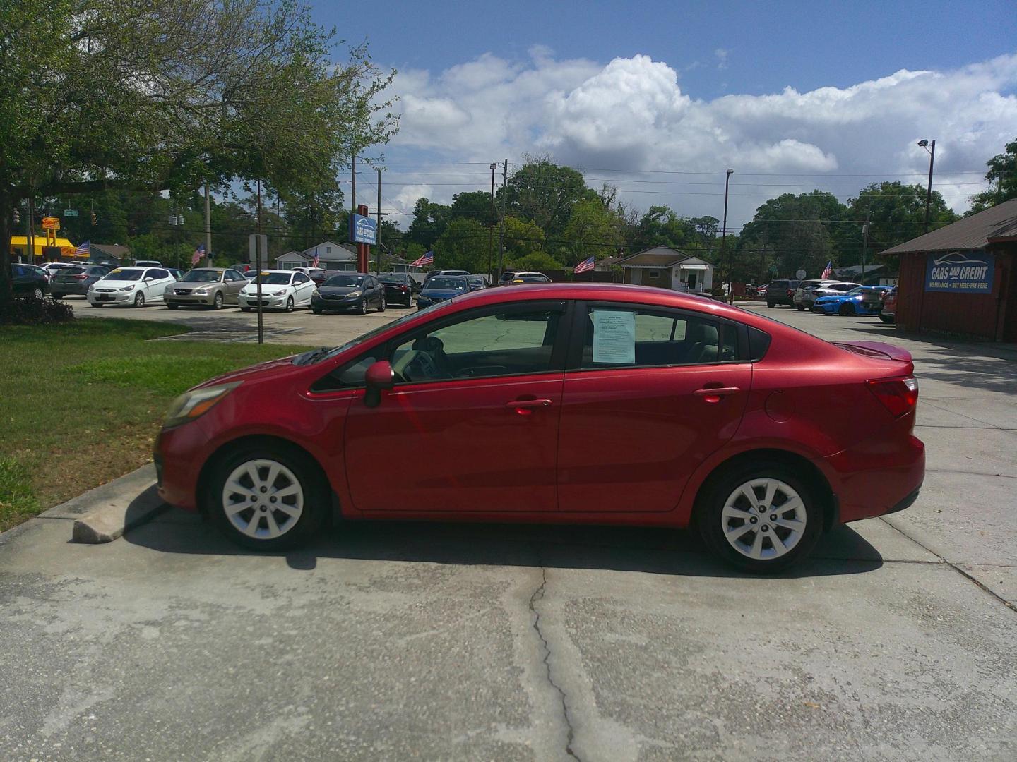 2014 RED KIA RIO LX (KNADM4A34E6) , located at 1200 Cassat Avenue, Jacksonville, FL, 32205, (904) 695-1885, 30.302404, -81.731033 - Photo#1