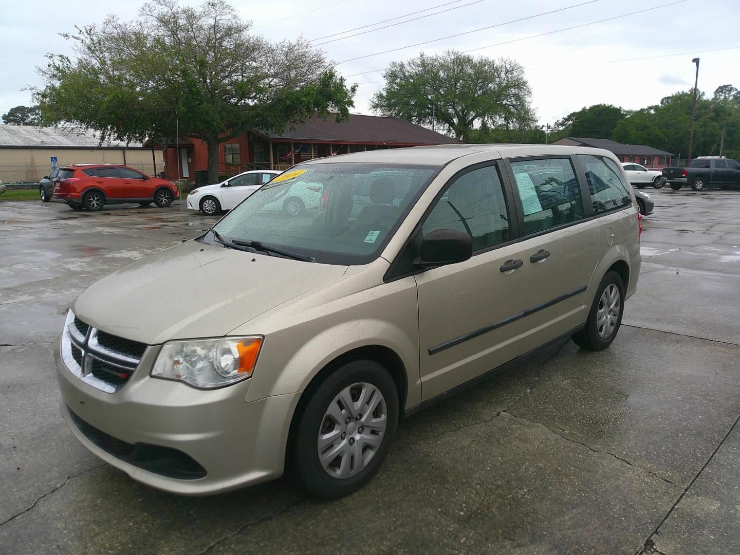 2014 TAN DODGE GRAND CARAVAN SE (2C4RDGBGXER) , located at 390 Hansen Avenue, Orange Park, FL, 32065, (904) 276-7933, 30.130497, -81.787529 - Photo#1