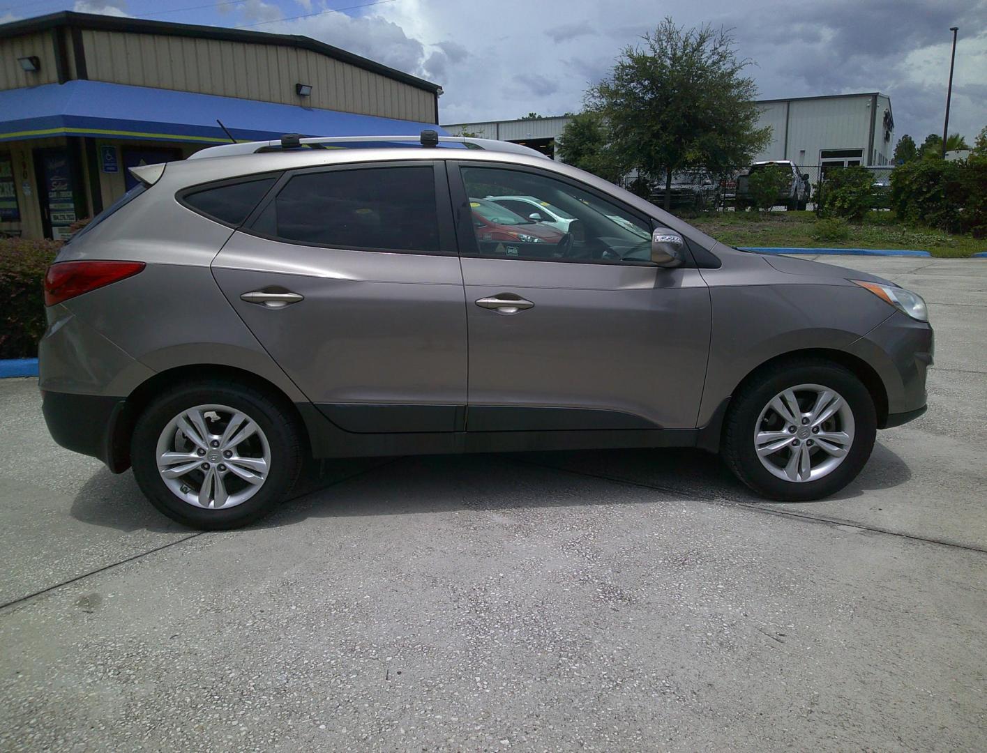 2012 GOLD HYUNDAI TUCSON GLS; LIMITED (KM8JU3AC5CU) , located at 390 Hansen Avenue, Orange Park, FL, 32065, (904) 276-7933, 30.130497, -81.787529 - Photo#2